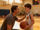 parent talking to young athlete after game with supportive encouragement